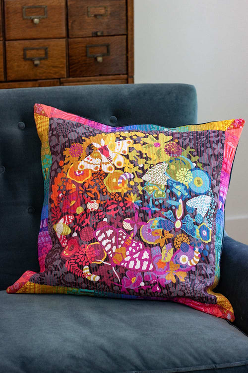 art theory pillow with neon peach quilting