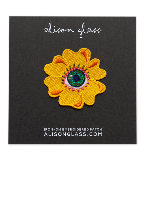 between eye flower patch in gold