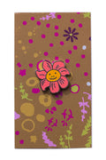 enamel smiling flower pin from the between collection