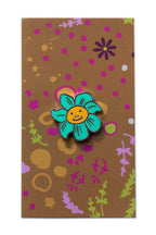 enamel smiling flower pin from the between collection