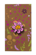 enamel smiling flower pin from the between collection