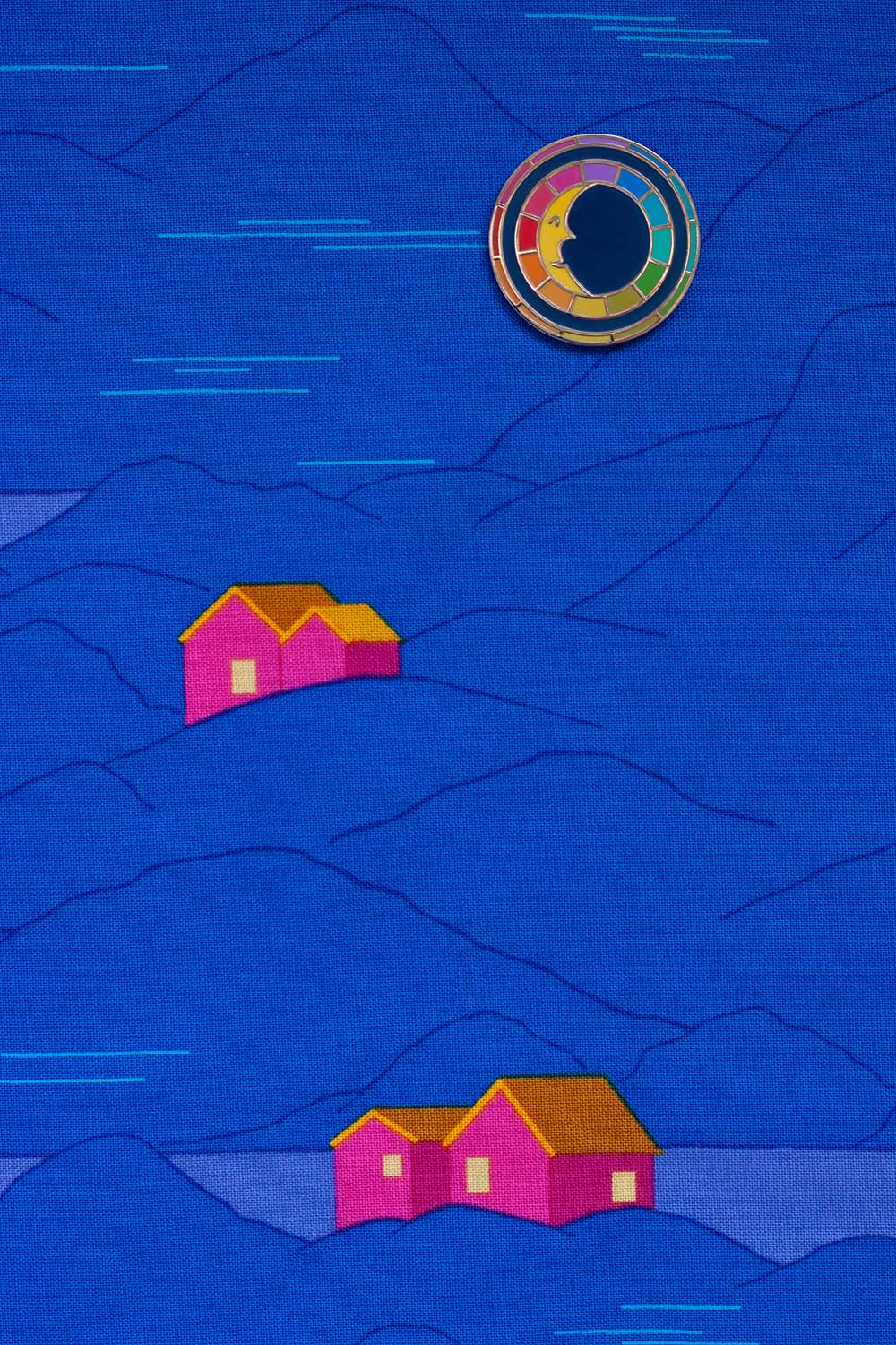 enamel moon pin from the between collection