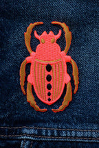 pink neon scarab patch