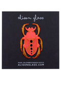 pink neon scarab patch