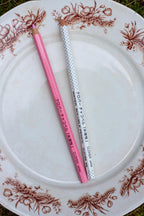 white and pink marking pencils