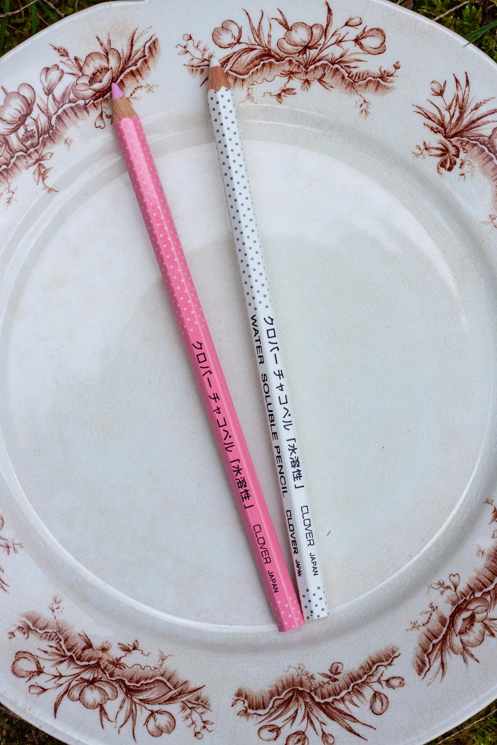 white and pink marking pencils